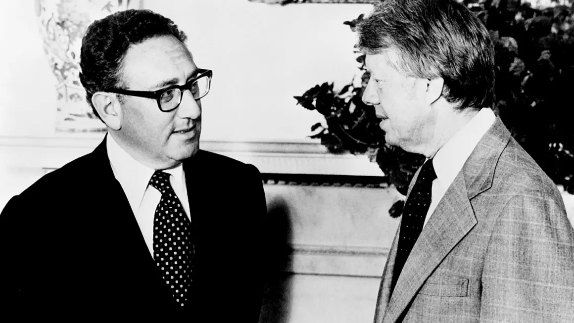 (FILES) US President Jimmy Carter (R) meets former Secretary of State Henry Kissinger to discuss Middle East peace proposals at the White House in Washington on August 15, 1977. Former US secretary of state Henry Kissinger, a key figure of American diplomacy in the post-World War II era, died November 29, 2023 at the age of 100, his association said. (Photo by AFP)