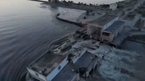 PHOTO/REUTERS -  A general view of the Nova Khakovka dam that was breached in Kherson region, Ukraine, June 6, 2023
