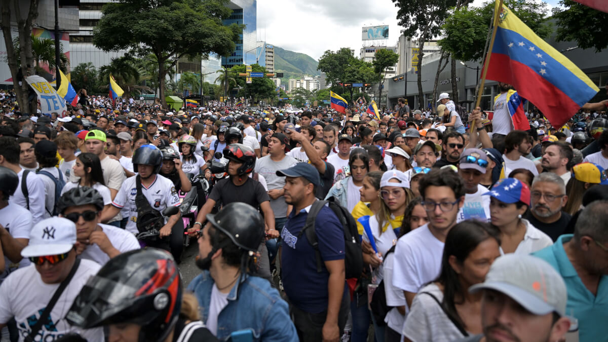 Opositores al presidente venezolano Nicolás Maduro en una manifestación convocada por el candidato presidencial Edmundo González Urrutia y la líder opositora María Corina Machado, frente a la sede de las Naciones Unidas en Caracas el 30 de julio de 2024 - Juan BARRETO / AFP